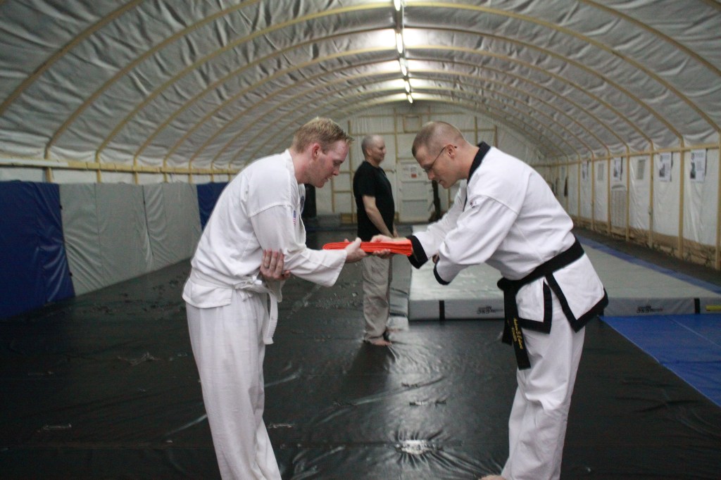 Mr. Jackson receiving his Orange Belt